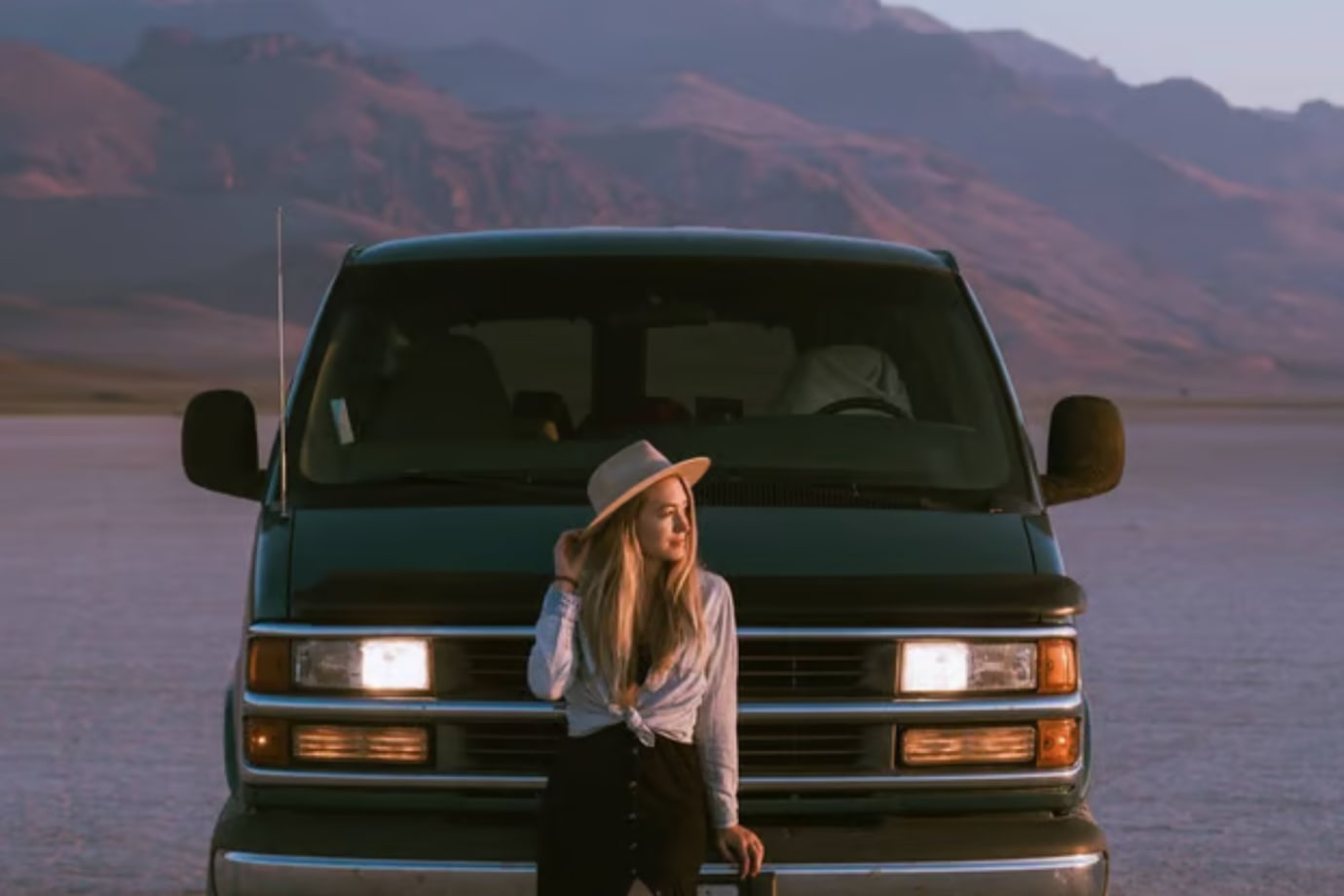 road tripper hanging out by her van