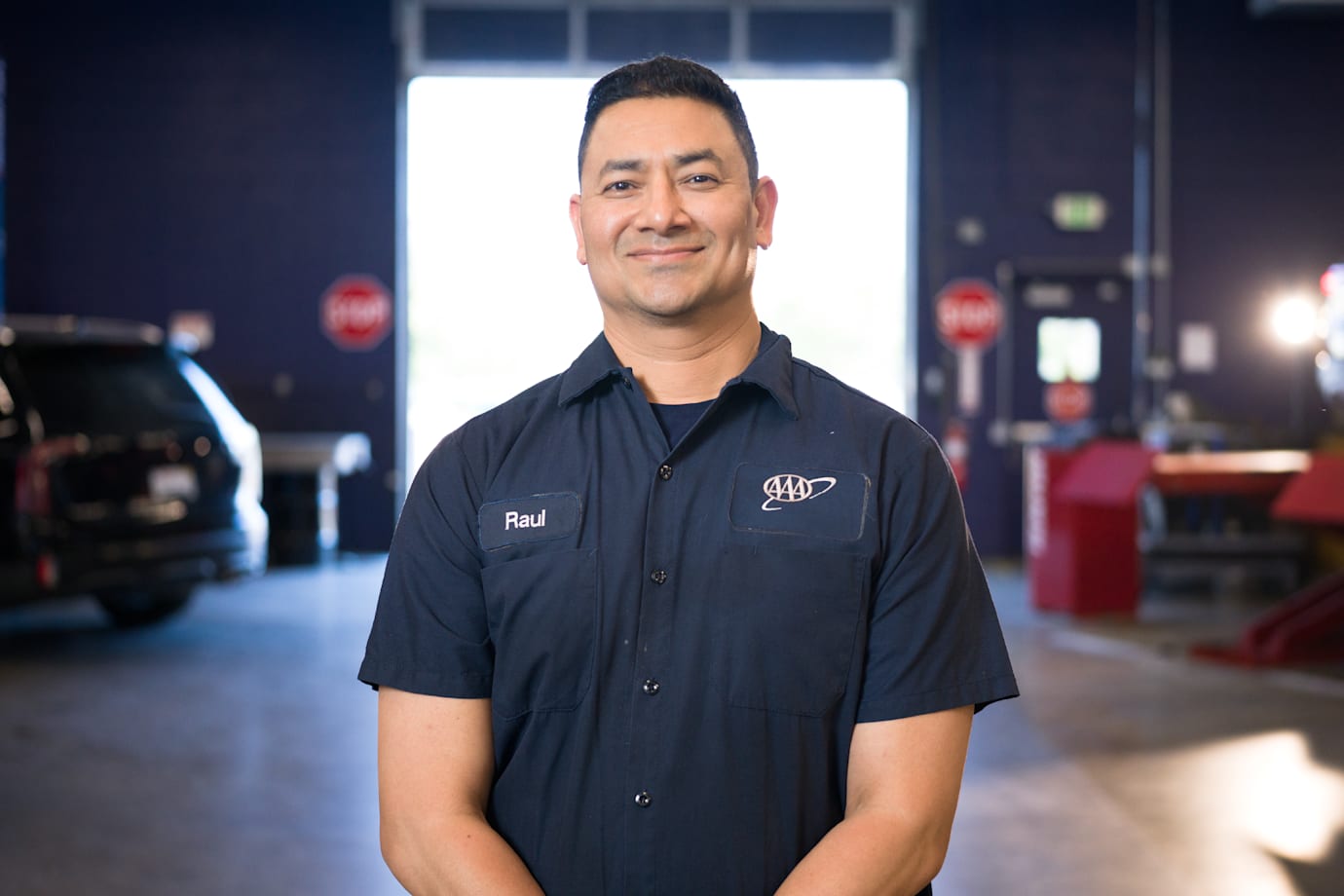 AAA auto repair center employee smiles