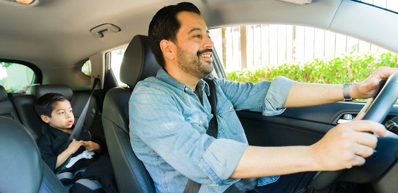 man driving car