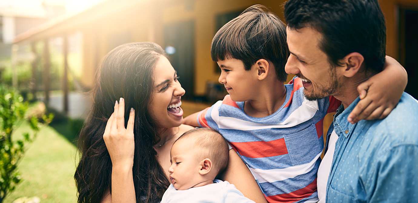 family smiling at each other