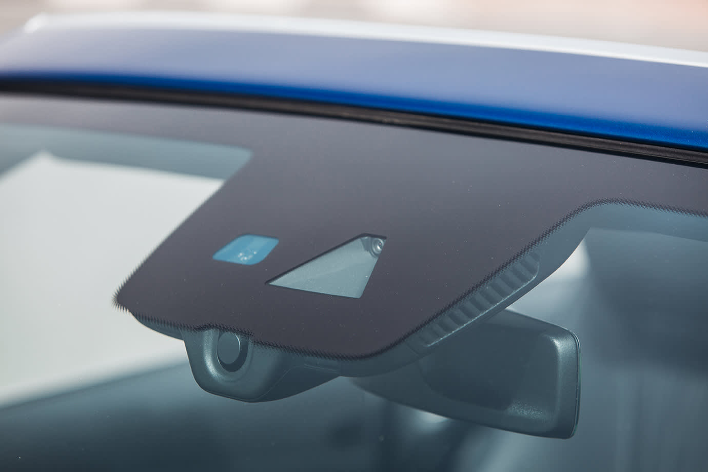 a car with an adas sensor on the windshield is recalibrated by AAA Auto Glass services