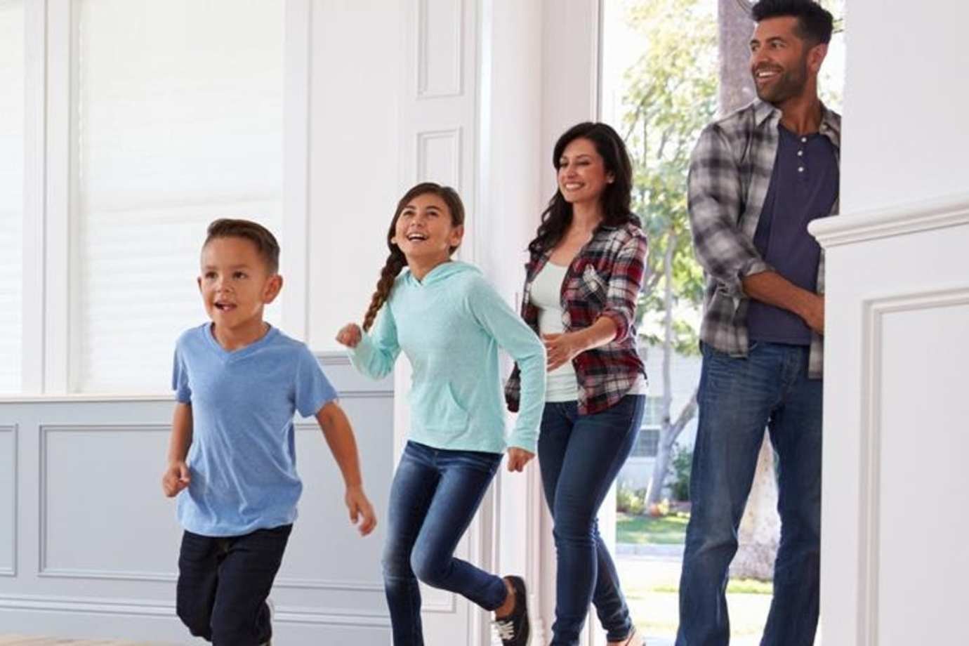 Happy family of AAA members enter their new home