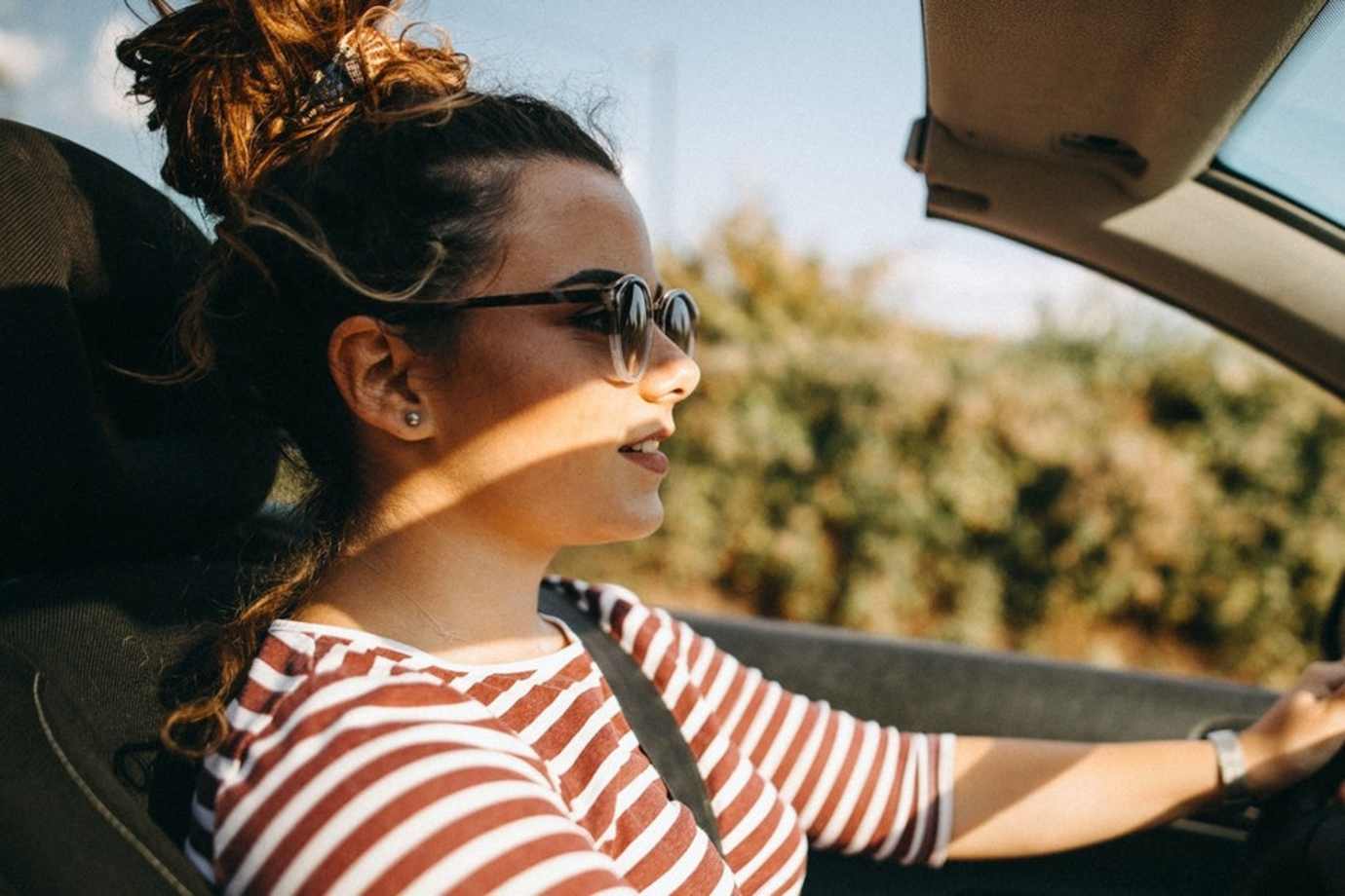 A teenage driver behind the wheel.