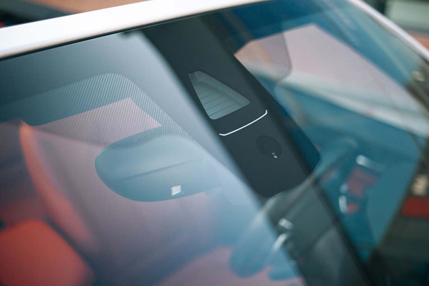 a car with an adas sensor on the windshield is recalibrated by AAA Auto Glass services