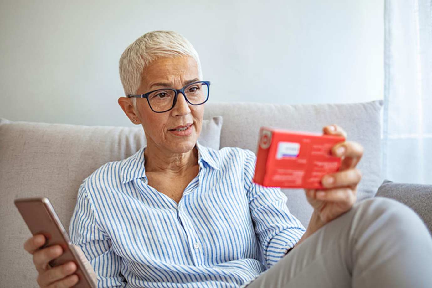 a woman looks up her medication on AAA's Roadwise RX
