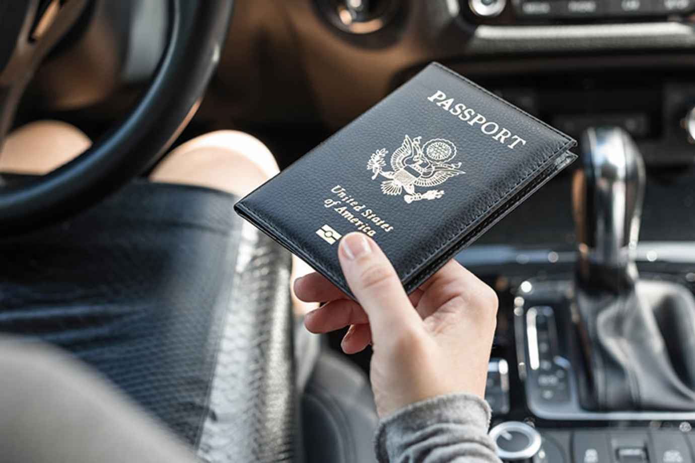 a woman with AAA Mexico driving insurancecrossing the Mexico border with her U.S. passport