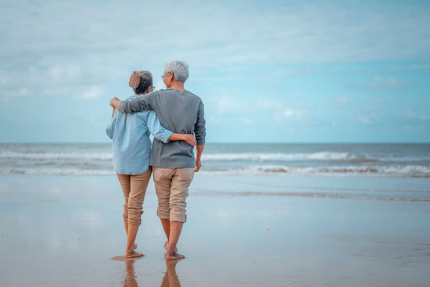 AAA Members with AAA Life Insurance walking on the beach