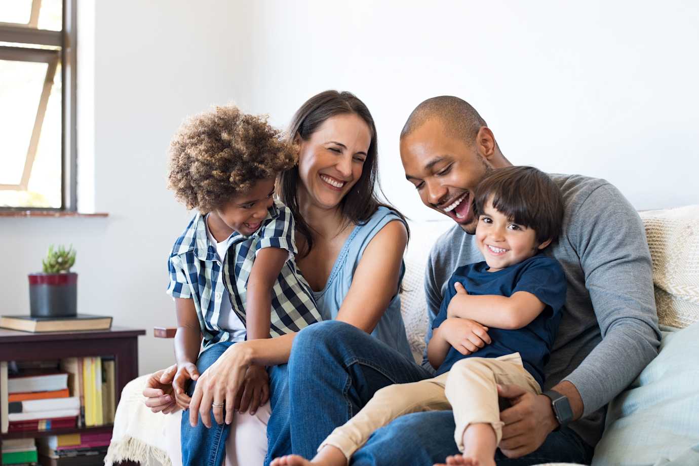 a happy family in their home protected by AAA home insurance