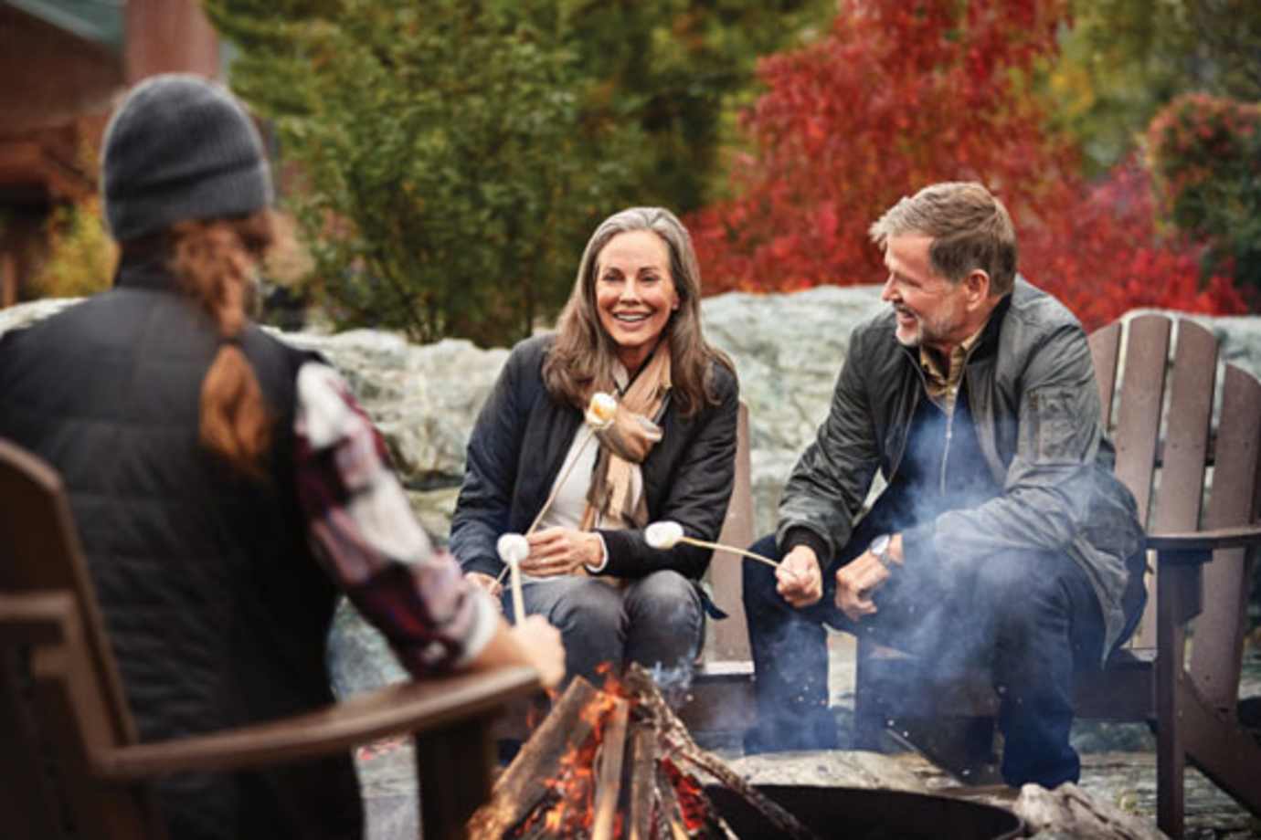 people enjoying a firepit on a princess alaska cruisetour