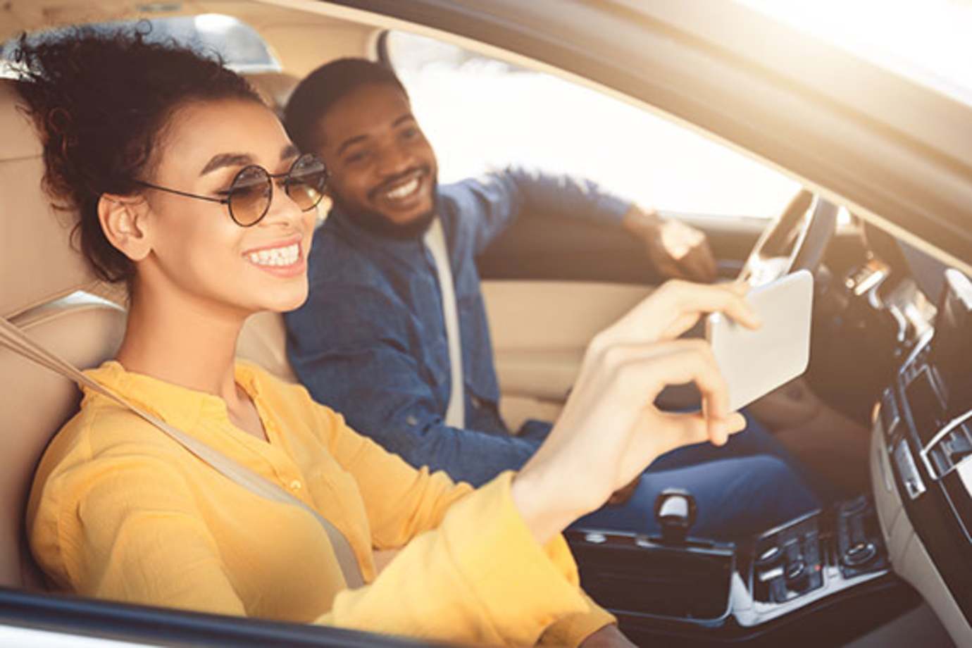a couple with aaa car insurance takes a selfie on their road trip