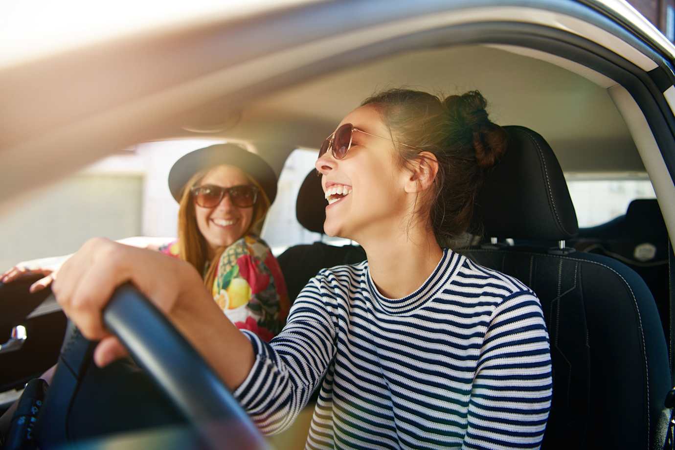 young women driving to brunch after filing dmv paperwork at aaa