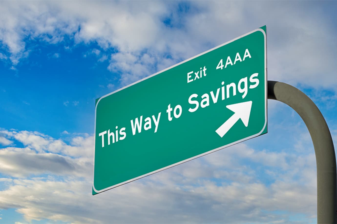 A highway sign says This Way to Savings at AAA
