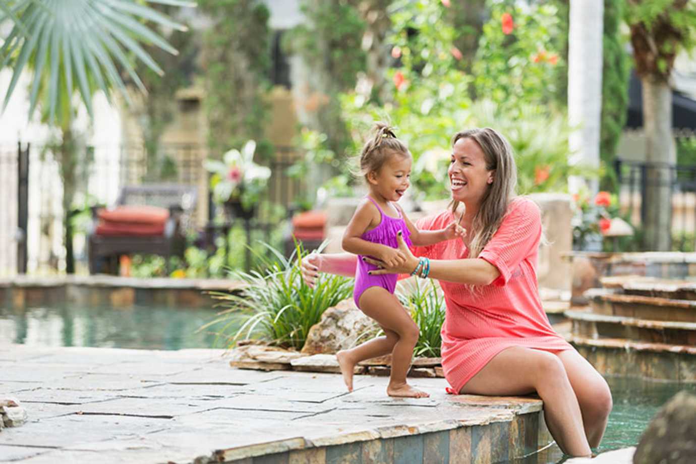 a girl and her mom on a vacation booked through AAA travel