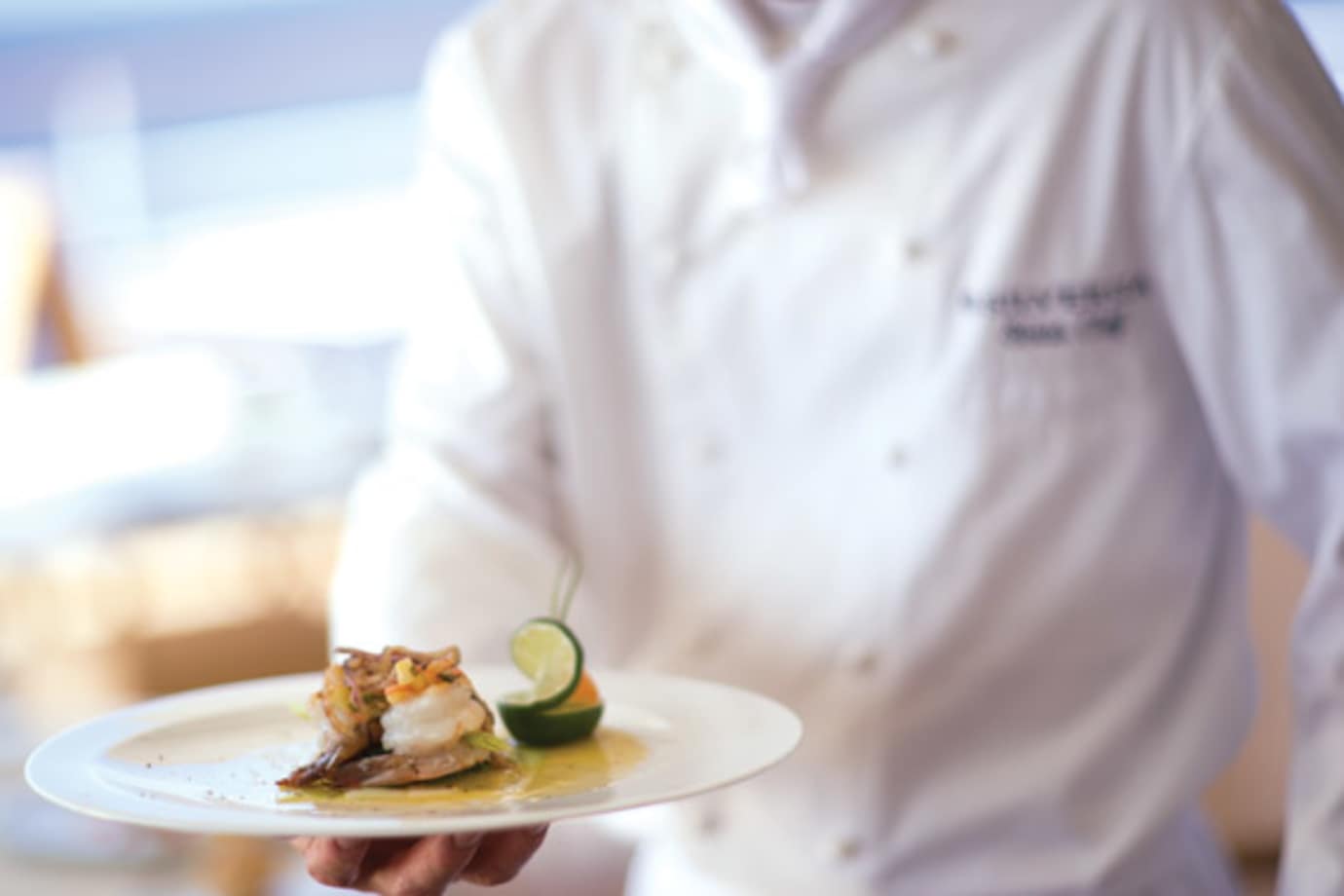 silversea chef with plate of food