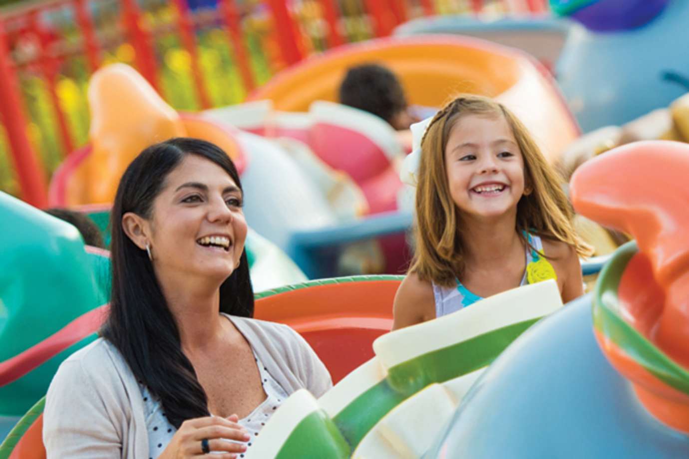 Mother and daughter riding the Dumbo ride