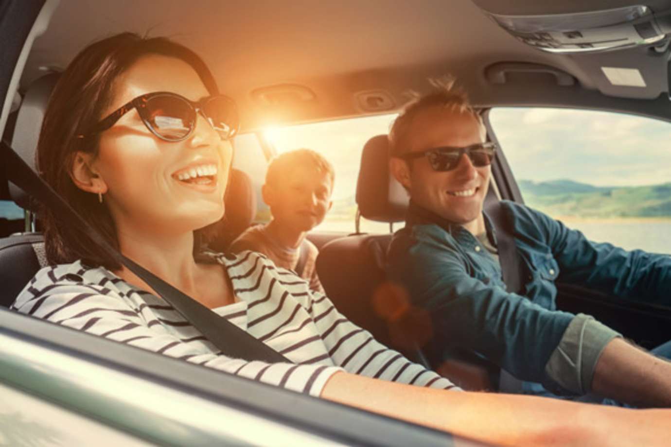 AAA Members watching the sunset at the beach enjoy travel and rental car benefits