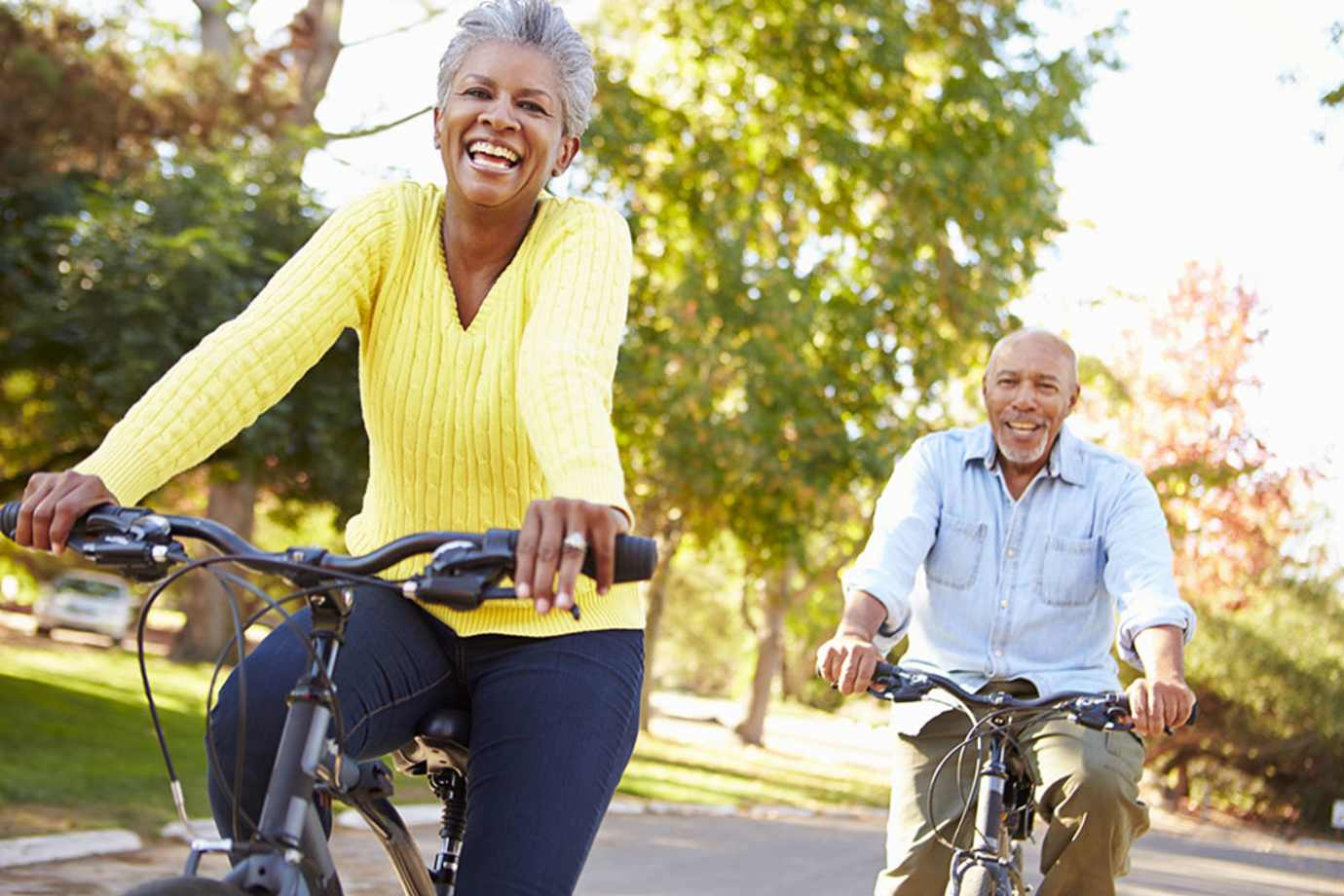 two runners insured with aaa term life insurance jog along a path