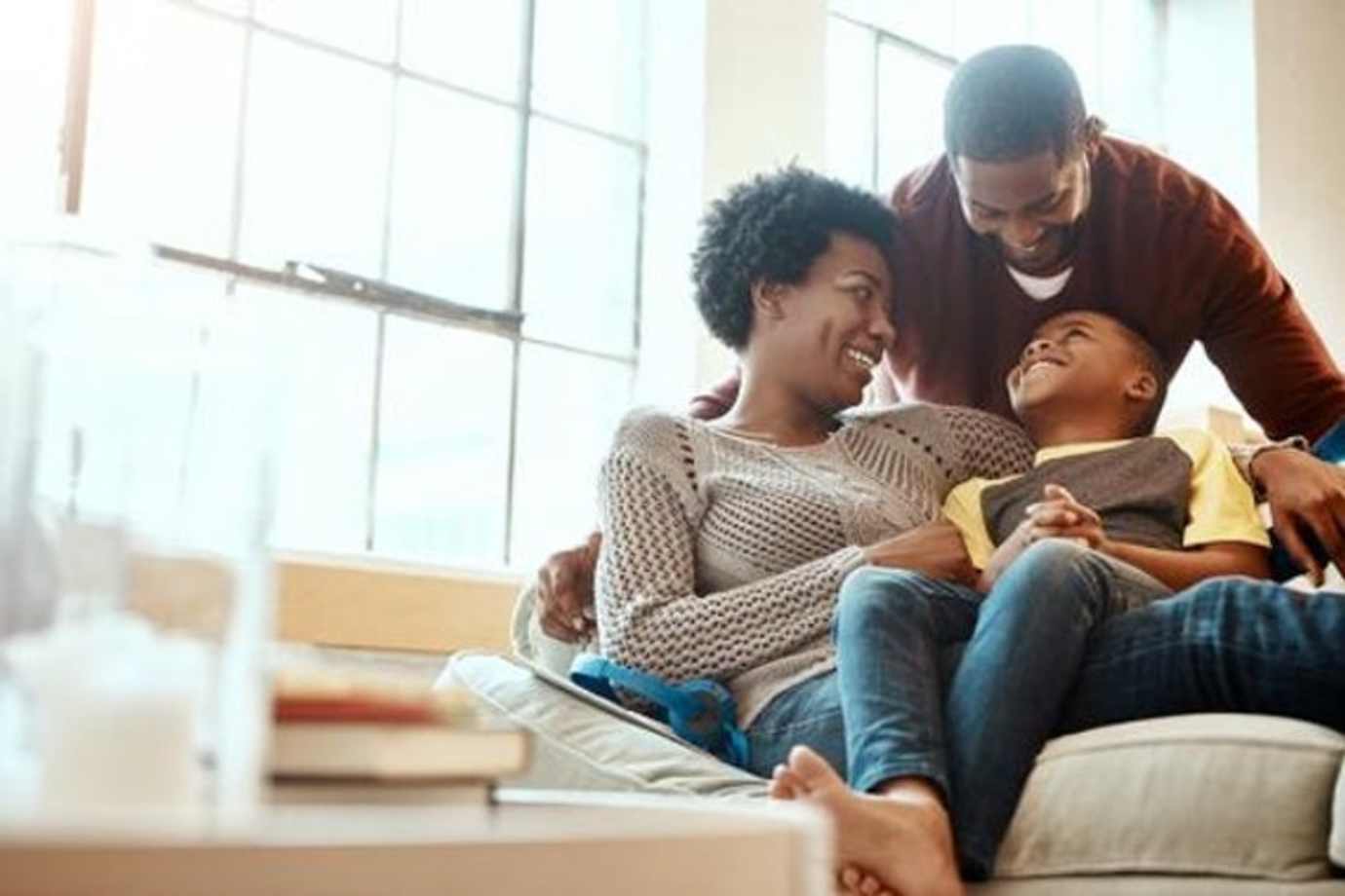 A family protected by an annuity sit on a couch