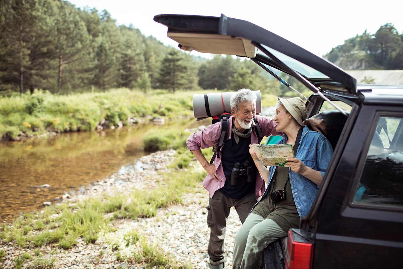 AAA Classic Members sit in the back of a  car, enjoying exclusive car rental and travel perks