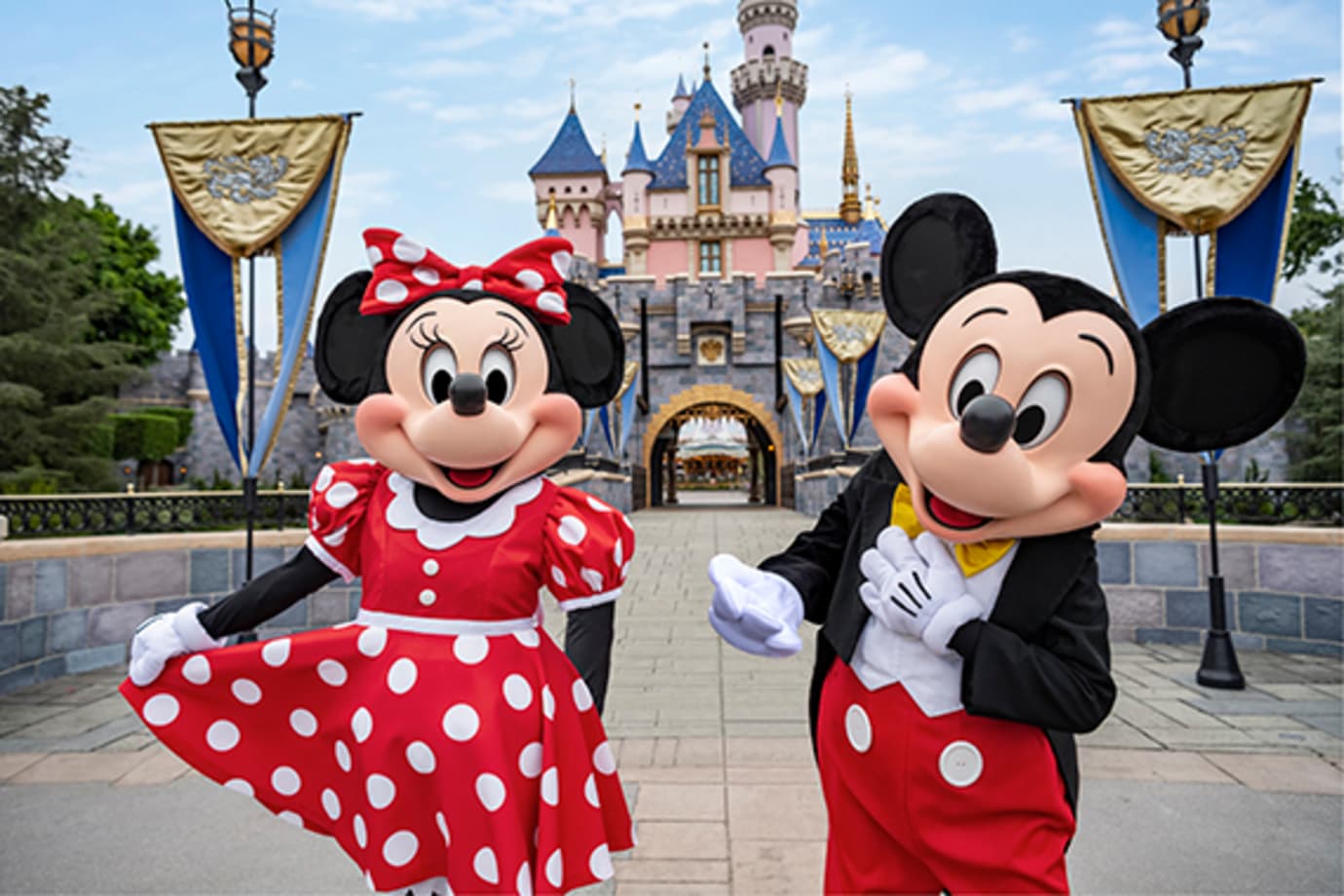 mickey and minnie in front of disneyland castle