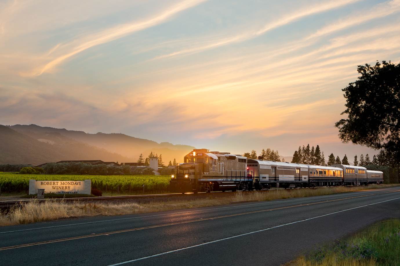 The Wine Train passes the Robert Mondavi Winery's To Kalon vineyard during late afternoon in Oakville, California.