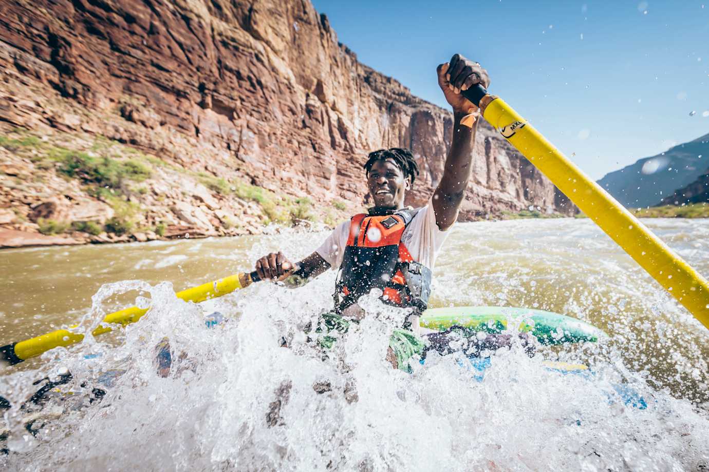 A person rafts down the Colorado River.