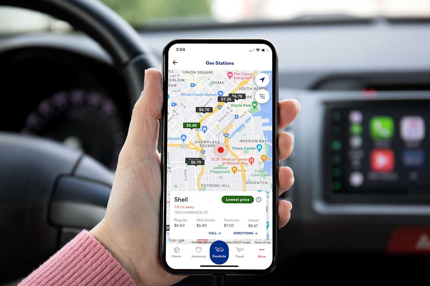 A driver looks for the cheapest nearby gas on the AAA Mobile App.