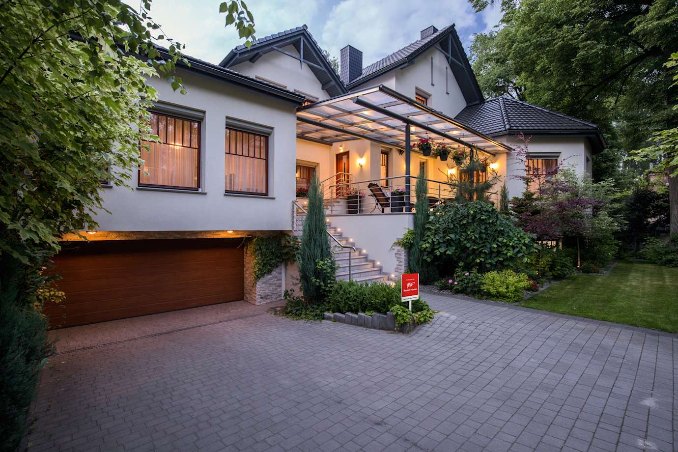 House exterior with AAA Smart Home Security yard sign in the front lawn