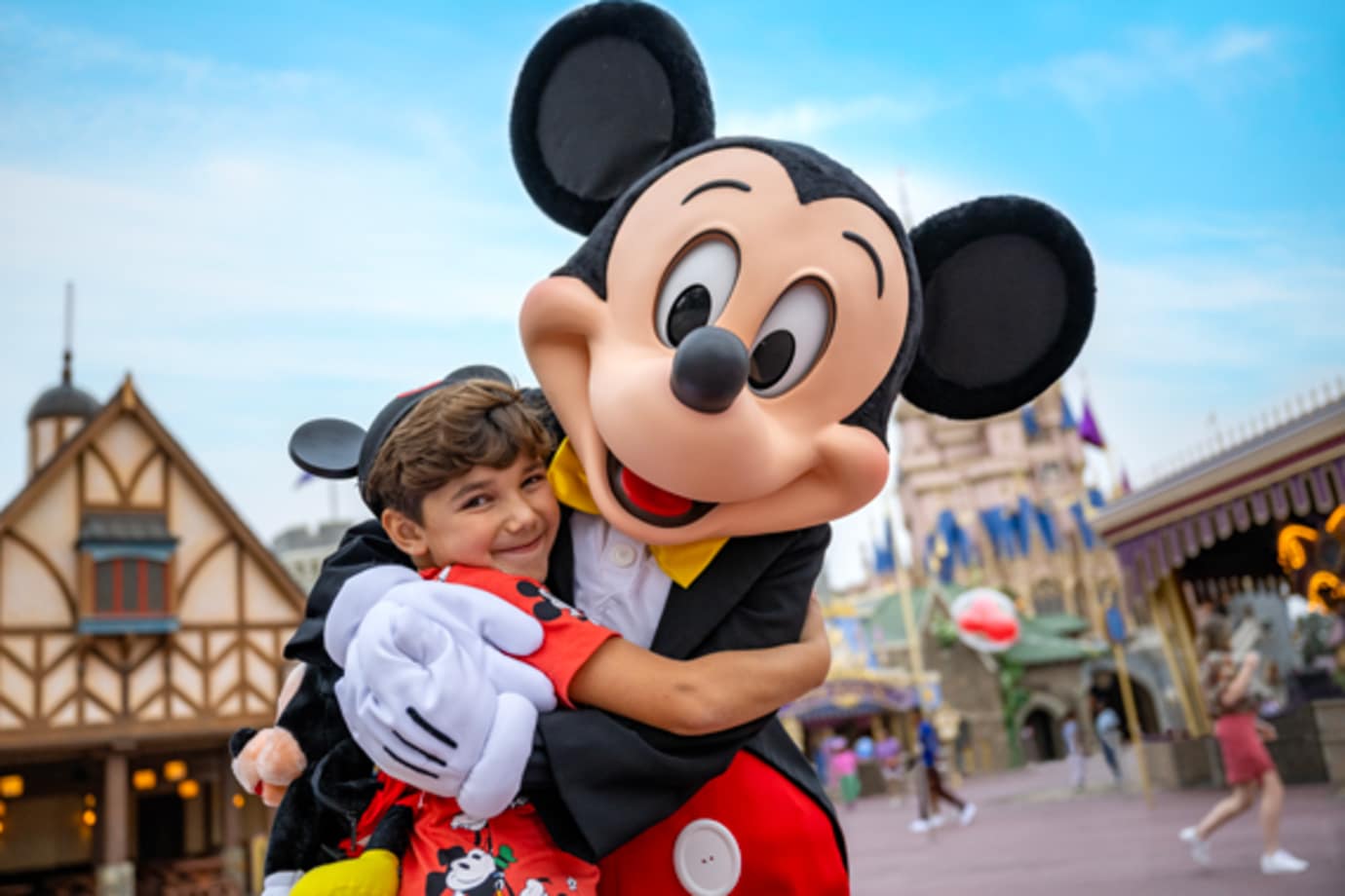 mickey mouse and child at walt disney world