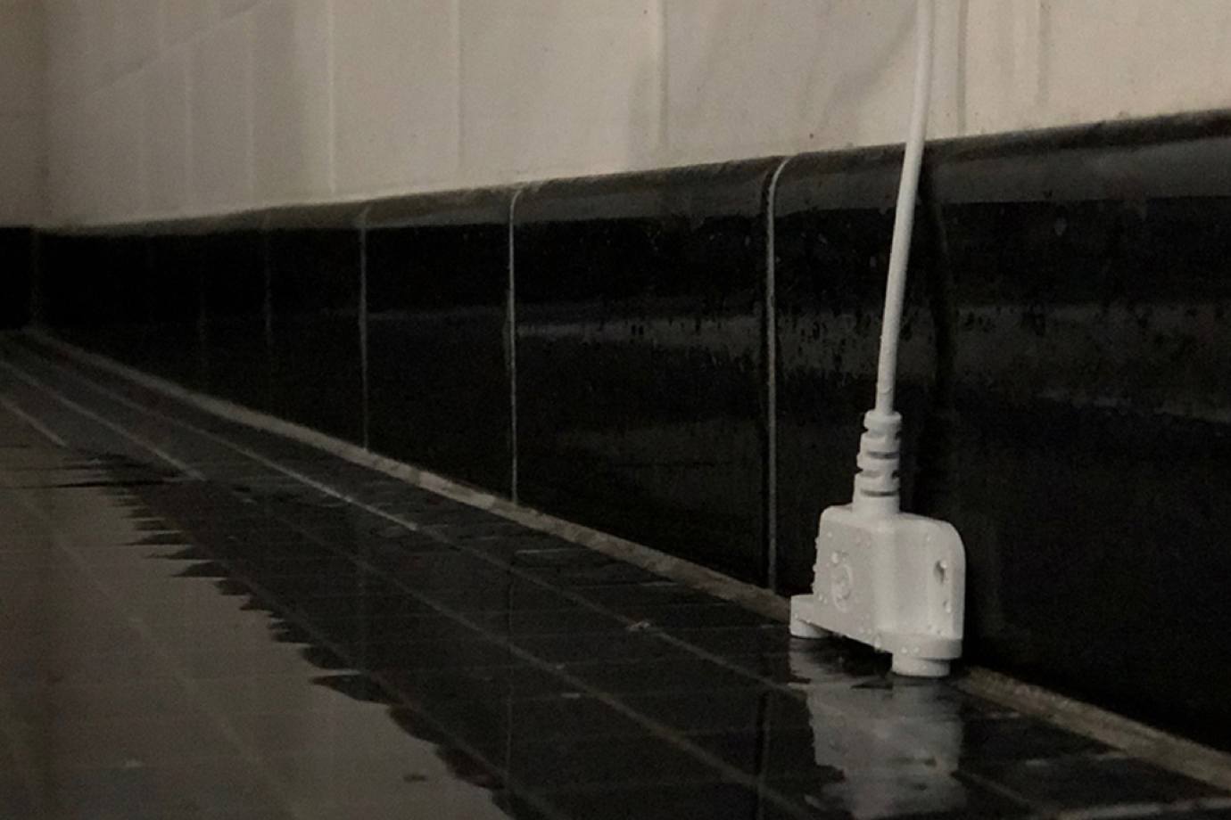 Flood sensor on wall