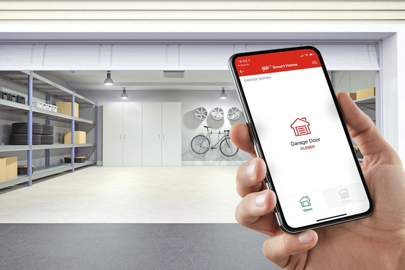 Person holding phone in front of garage