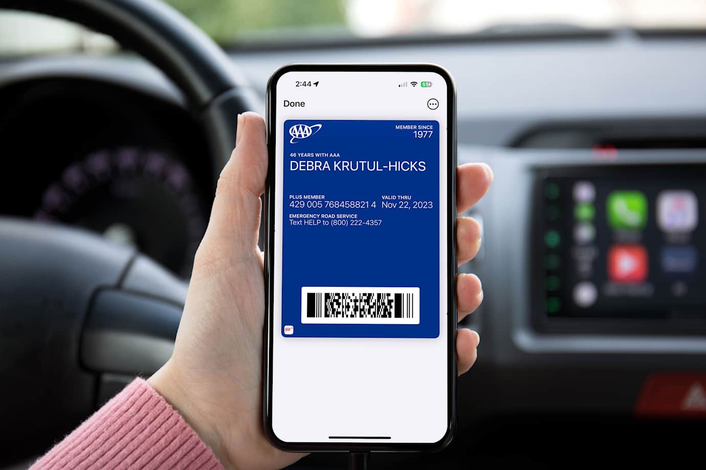 A driver pulls up their digital AAA Membership card on their phone.