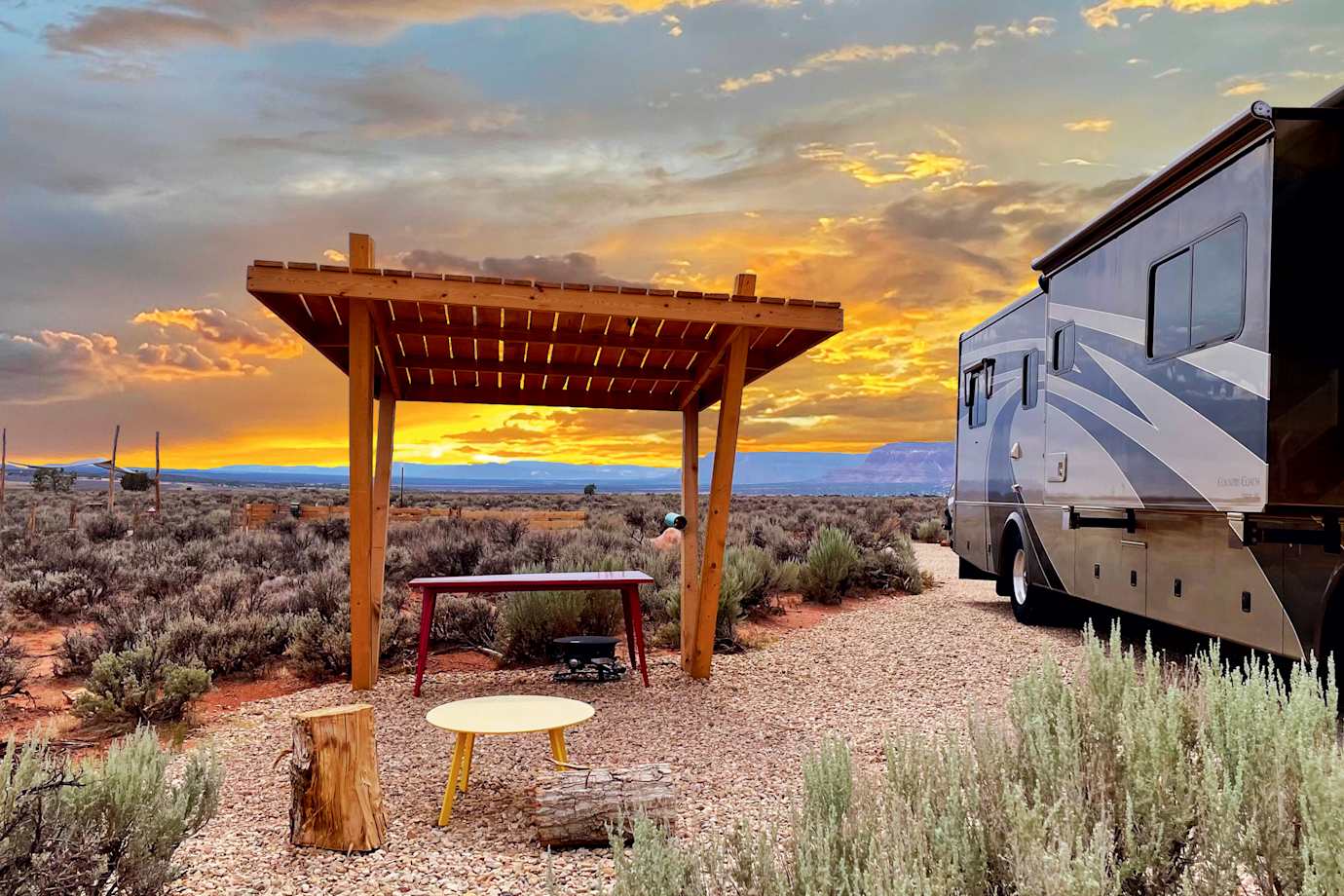 The sun sets behind a shade structure at Dark Sky RV Park and Campground in Kanab, Utah.