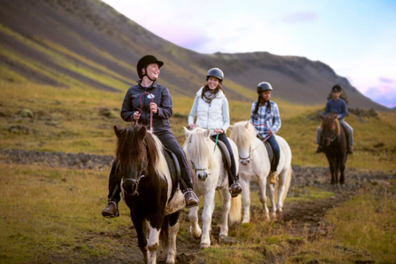 guide and guests riding horses on an adventures by disney vacation in iceland