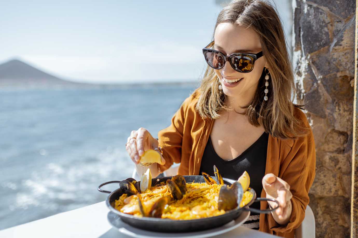woman eating paella in spain