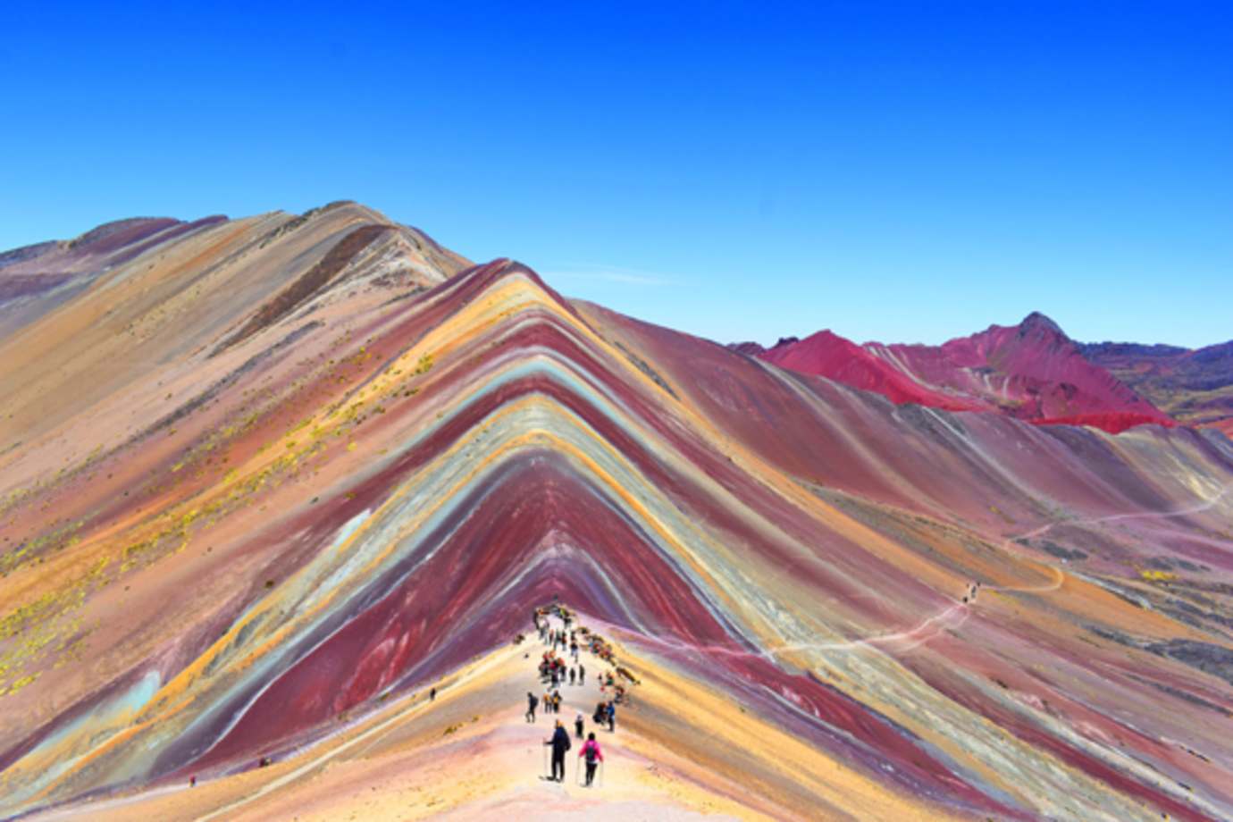 People touring rainbow mountain in peru