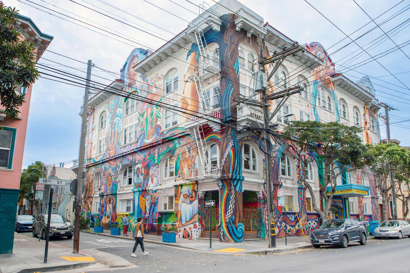 A mural covers the multi-story women's building in San Francisco's Mission District.