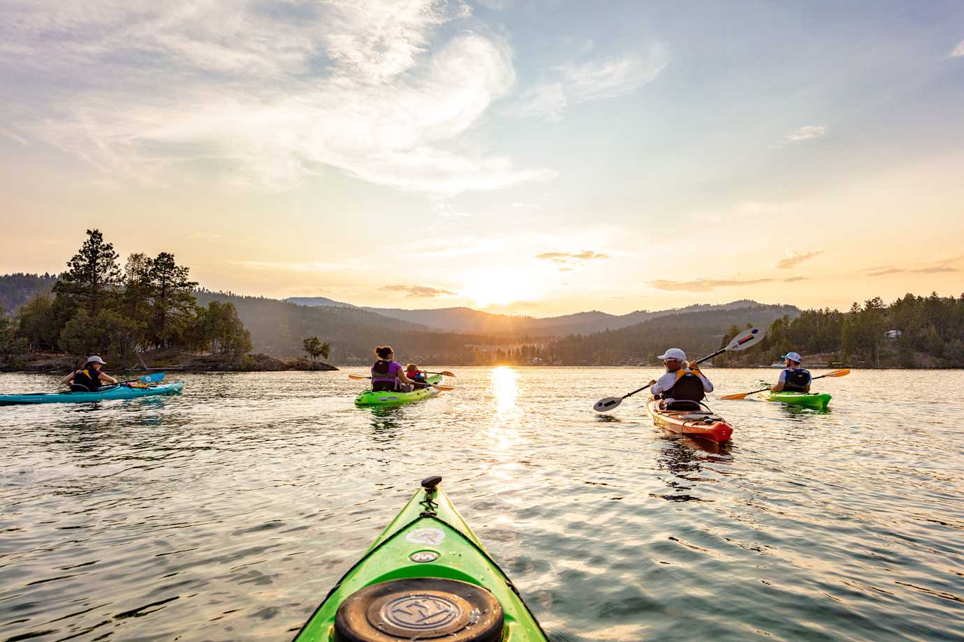 A family kayaks on Flathead Lake in Montana.