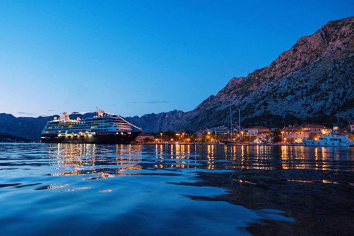 azamara ship docked in port at nightfall