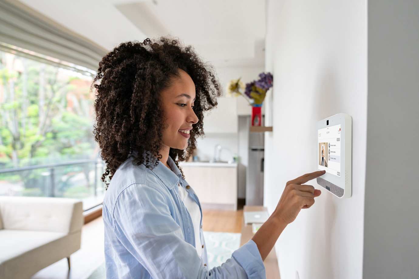 Woman using Smart Home panel