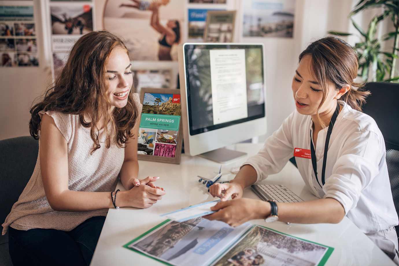 AAA travel advisor helping member