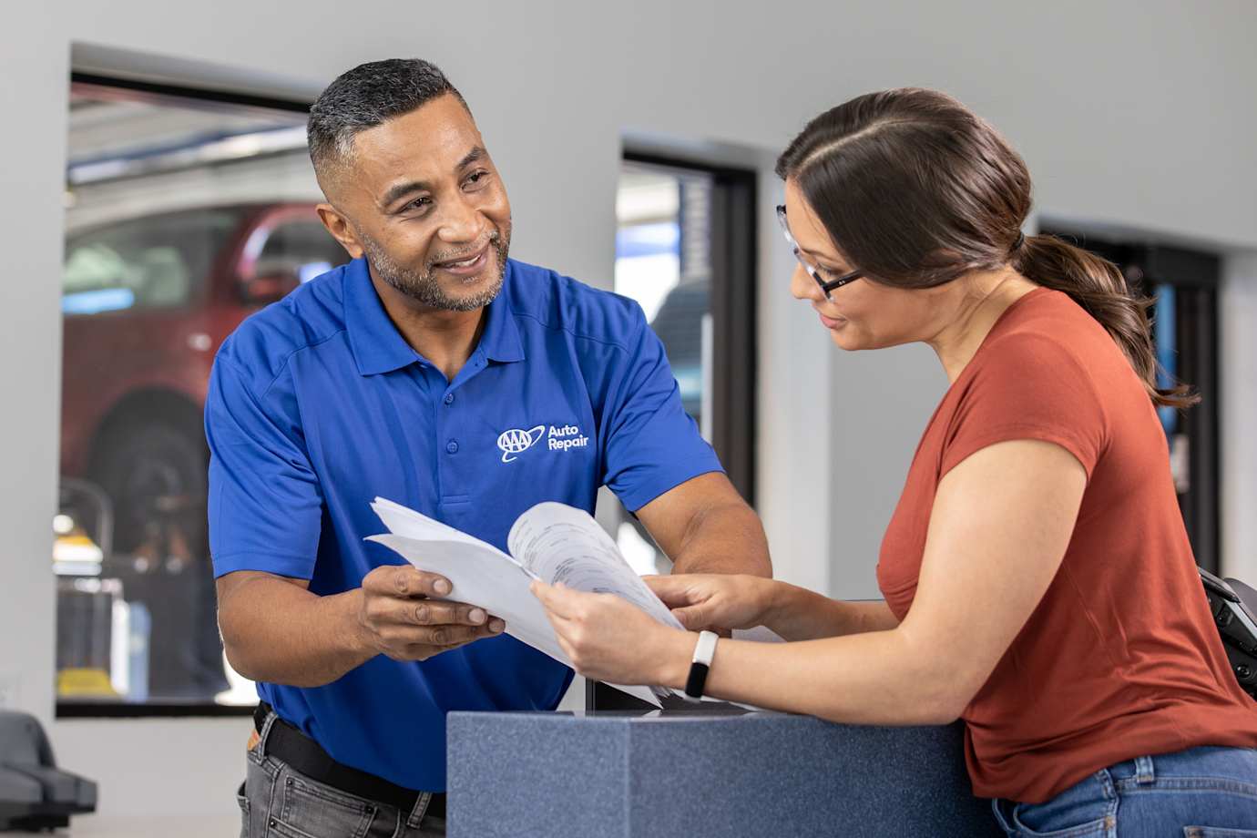 AAA Auto Repair Center expert helps a customer