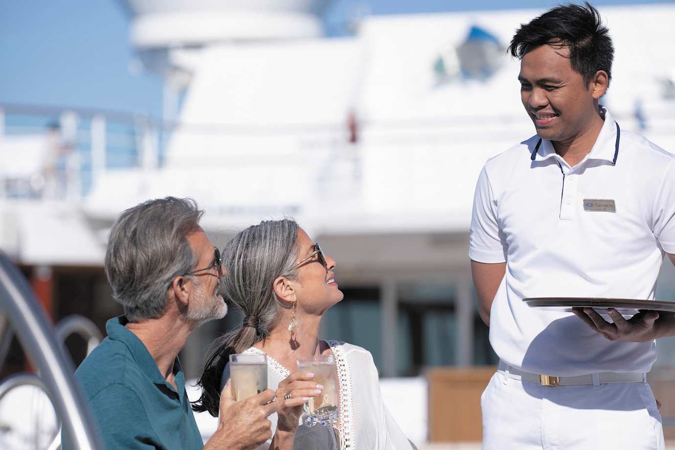 guests on regent seven seas cruise ship pool deck