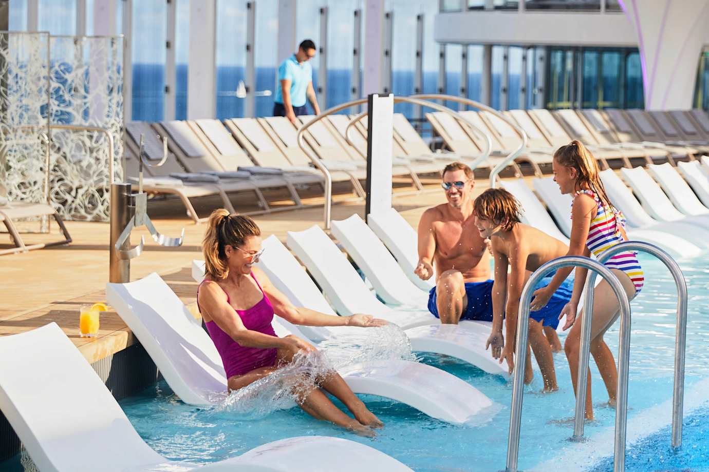 family by a celebrity cruise ship pool