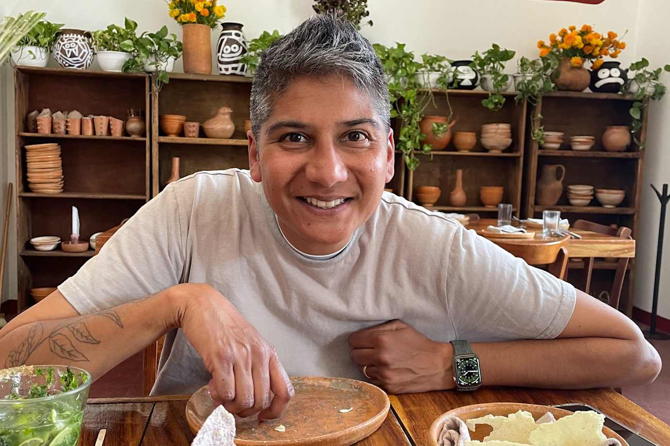 Headshot of Via Podcast guest, chef Preeti Mistry at a table.
