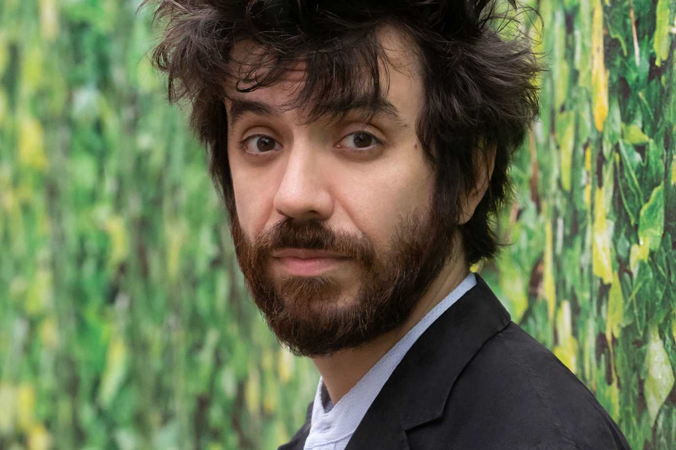 Headshot of Via Podcast guest Kaveh Akbar