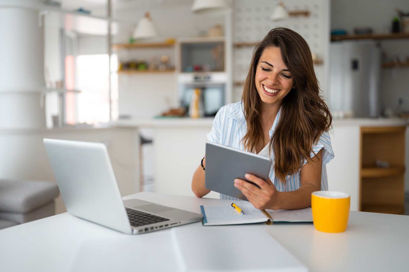 A woman looks at her 401(k) balance on her tablet.