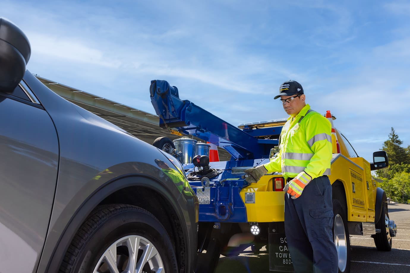 AAA roadside assistance technician tows a AAA Member vehicle
