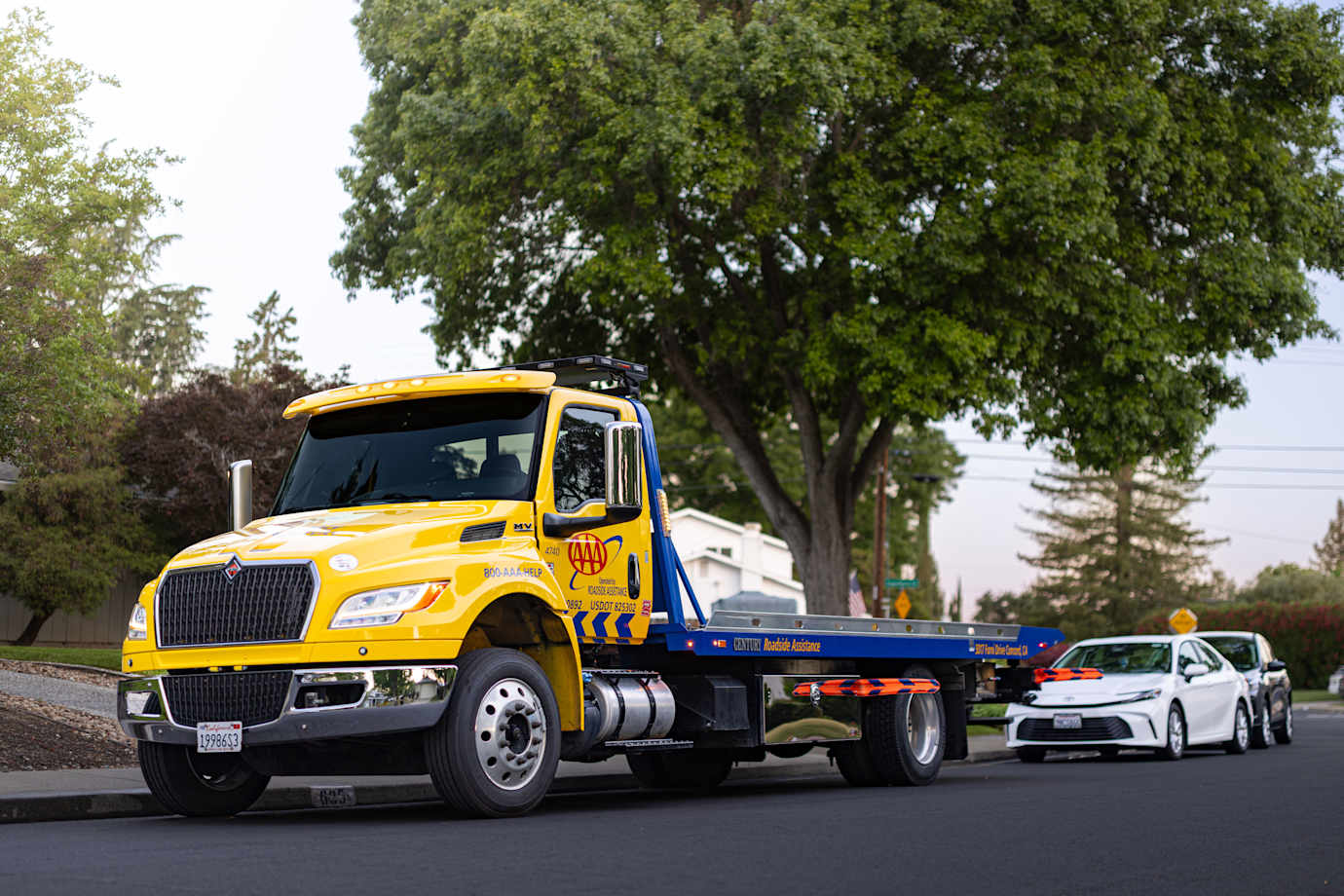 A AAA Mountain West Group flatbed tow truck with high visibility air-bars.