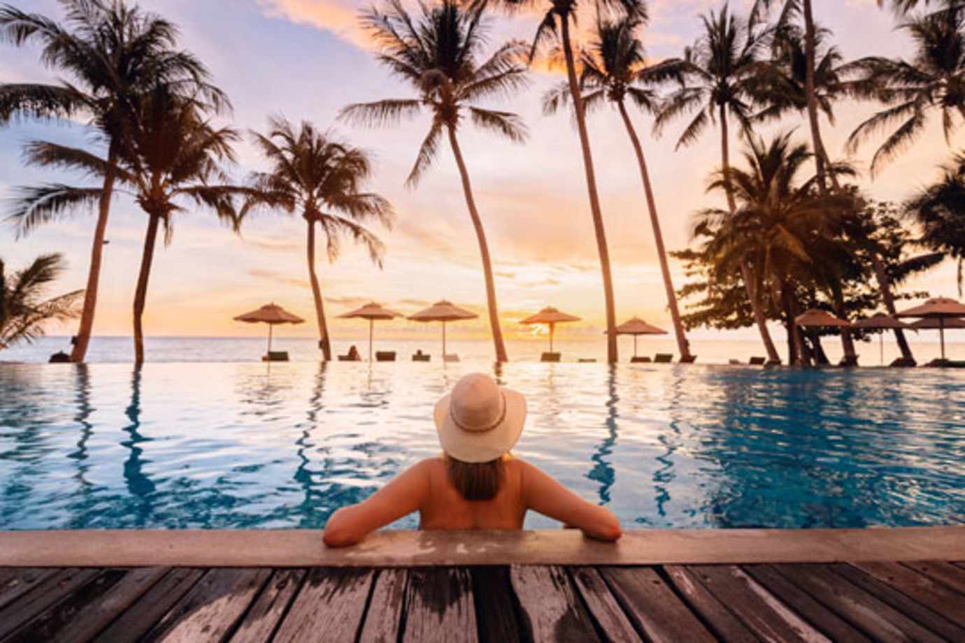 woman in pool on a mexico all-inclusive vacation